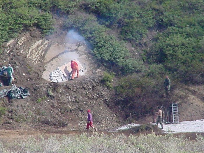 By Friday afternoon, the sun appeared and the site warmed up and dried out. The tarp was removed and a wood frame was placed around Icky to aid in movement and transport.