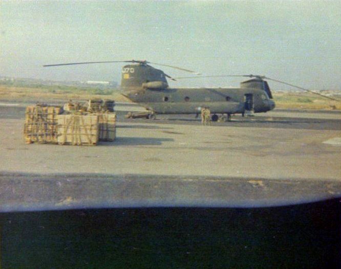 Ground Alert: CH-47A Chinook helicopter 66-19070, belonging to the 237th Helicopter Squadron of South Vietnamese Air Force (VNAF), sits on the ramp at Long Binh Army Air Field. The aircraft was preparing to deploy to the An Loc area battlefield on an ammunition resupply mission for soldiers fighting in response to Charlie's insurgency. The Flight Engineer, Long Nguyen, snapped the photograph in 1972.