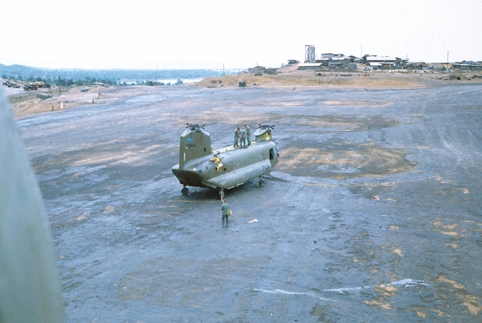 CH-47A Chinook helicopter 67-18518 sitting on the ground at what is thought to be An Khe in the Republic of Vietnam, approximately early 1970. 67-18518 had suffered from some unknown mechanical difficulty that required the aircraft to be air lifted out for maintenance. At the time, 67-18518 was owned and operated by the 196th Assault Support Helicopter Company (ASHC) - "Flippers". The location of where the aircraft was transported to is unknown.