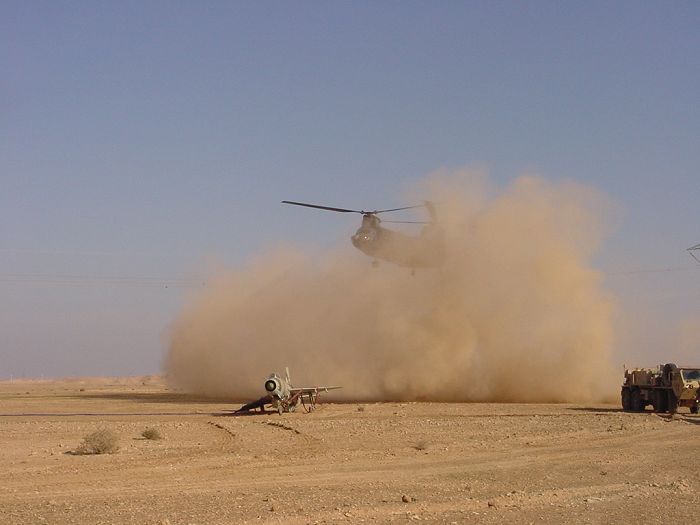 89-00142 hovering in to pick up the wrecked Iraqi MIG-21.