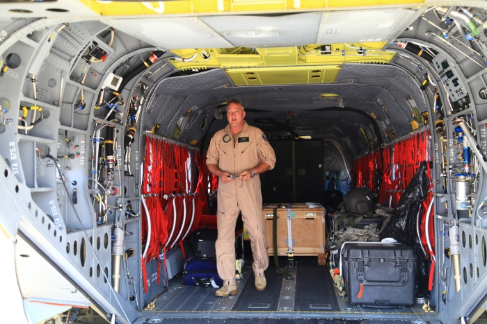 10 April 2012: Tim McCall walks off the ramp of CH-47F Chinook helicopter 08-08764 while parked at Campbell Airfield, Fort Campbell, Kentucky, during a full stop.