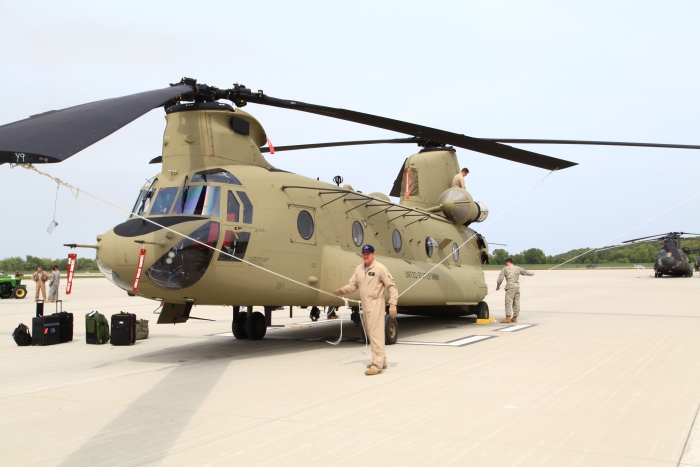 20 September 2012: Flight Lead Ship 10-08802 gets tied down on the ramp at Marshall Airfield, Fort Riley, Kansas, by S3 Incorporated's Standardization Flight Instructor Roy Payne after completing the ferry flight from Millville, New Jersey.