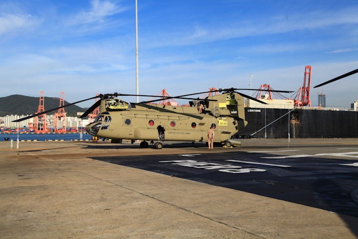 8 November 2013: Flight Engineer Wade Cothran inspects the top of the aircraft while Tim McCall, Standardization Pilot, looks at the bottom. This was Tim's last ride in a CH-47F before being forced to leave the NET Team.