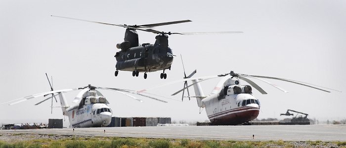 Australian CH-47D Chinook helicopter A15-103 hovering near two MI-26 "Halo" helicopter somewhere in Afghanistan, date unknown.