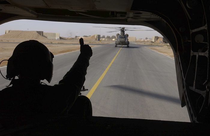 As the Ramp Gunner gives the thumps up, another CH-47D of the Australian Special Forces Task Group (SFTG) prepares to lift off.