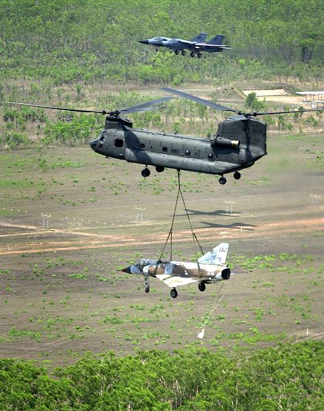 An Australian Chinook transports an old Mirage fighter aircraft to Tyndal Air Force Base in the Northwest Territories, circa 2001.