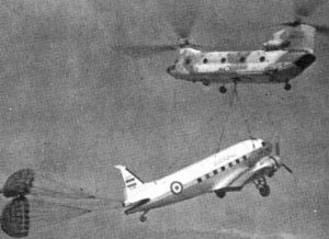 An Iranian CH-47C transporting a C-47D to a museum.