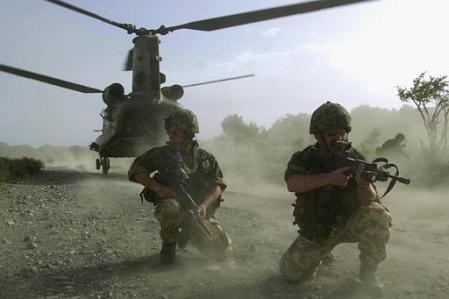 Royal Marine's of 45 Commando disembark from a Chinook aircraft.