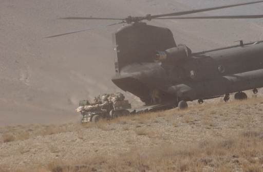 A CH-47D Chinook lands in a field  near Bagram Air Base, Afghanistan.