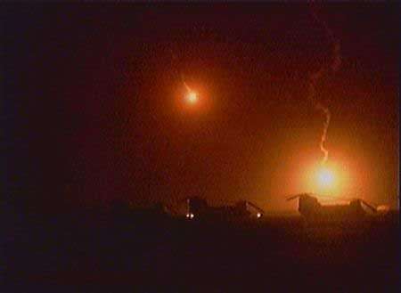 Valentines Day - Flares fall from the sky near three United States Army CH-47D Chinook helicopters.