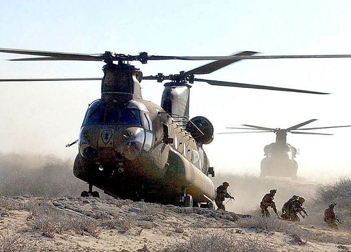 Soldiers of the 25th Infantry Divisions 1st Battalion, 21st Infantry Regiment, exit a CH-47D Chinook helicopter, tail number unknown, operated by crews of the divisions 2nd Battalion, 25th Aviation Regiment, during a recent air assault mission on the island of Molokai, Hawaii. The Hawaii-based "Tropic Lightning" division is preparing for deployment to Afghanistan.