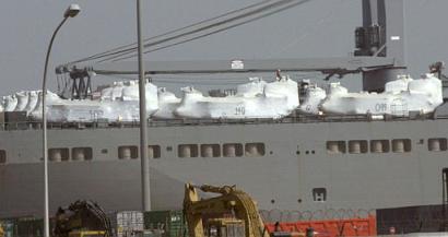 Monday, 23 February 2004, U.S. Army Chinook helicopters, shrink-wrapped in white plastic, are loaded on the upper deck of the USNS Pomeroy docked at Shuaiba Port, some 70 km south of Kuwait City. A quarter-million soldiers are on their way to, or from, the war in neighboring Iraq in, according to military planners, the largest rotation of U.S. forces in history.