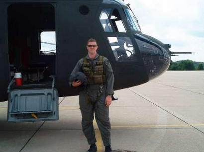 U.S. Army First Lieutenant Brian Slavenas is shown in front of a Chinook helicopter in this undated family photo. Lt. Slavenas was one of the pilots of the U.S. Army Chinook helicopter that was shot down in Falluja, Iraq