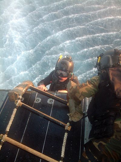 Senior Airman Luke Naughton, 320th Special Tactics Squadron, Kadena Air Base, Japan, climbs out of Subic Bay during pararescue training with Philippine forces recently during Balance Piston 03-5.