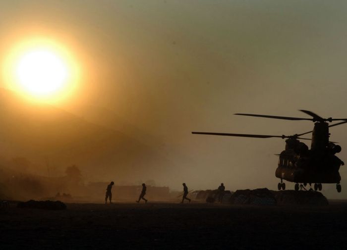 21 December 2005: Soldiers from Task Force Eagle deliver humanitarian supplies to a remote village in northern Pakistan via their CH-47D Chinook helicopter. People in that area, devastated by the 8 October 2005 earthquake, are in desperate need of food, winter clothing and other supplies, as snow has blanketed much of the area.