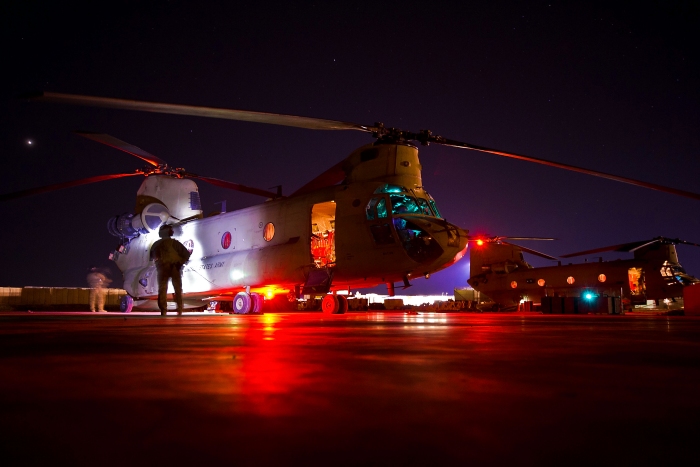 24 February 2012: U.S. Army Staff Sgt. Carlos Gonzales and Sgt. Ernesto Gallegos assist pilots during a run up of a CH-47F Chinook helicopter on Camp Marmal, Afghanistan. Gonzales is a Flight Engineer Instructor (FEI) and Gallegos is a Crew Chief (CC). Both are assigned to the 1st Cavalry Division's Company B, 1st Air Cavalry Brigade, Task Force Lobos.